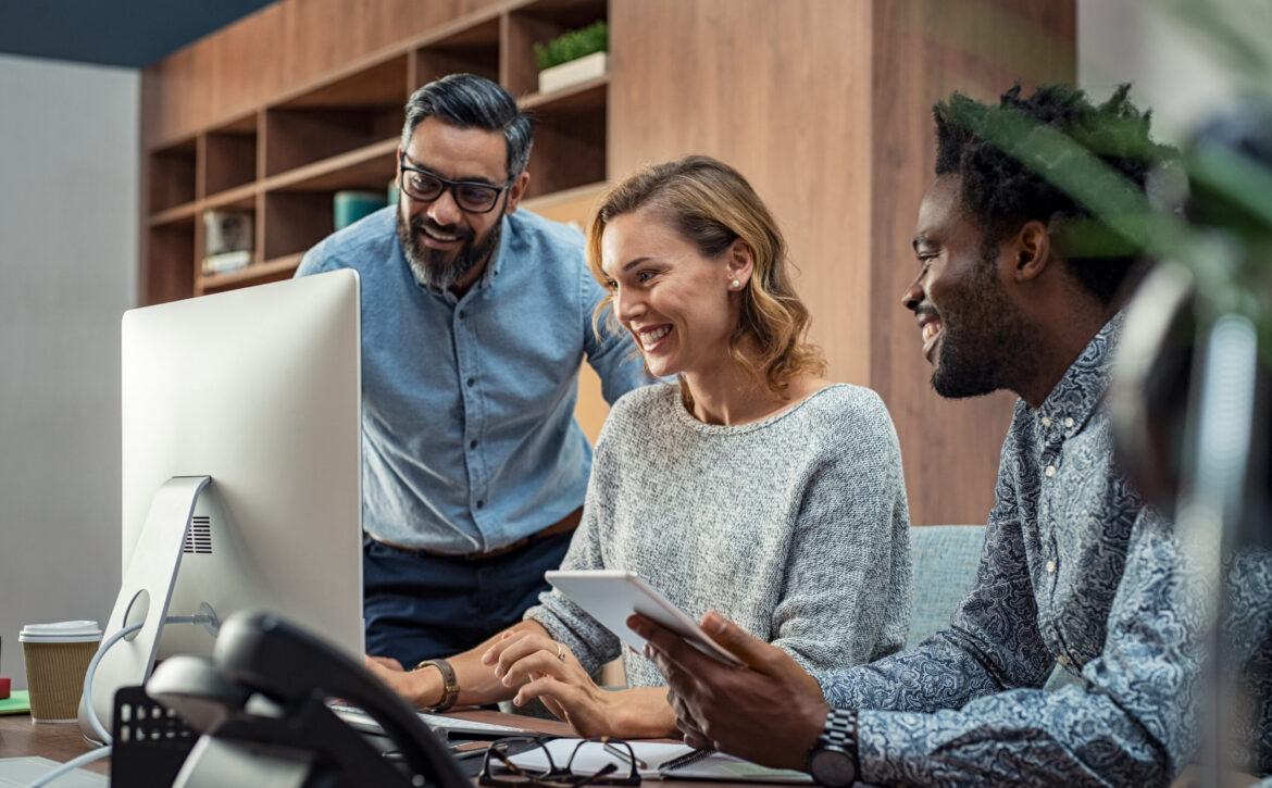 Happy business team working together